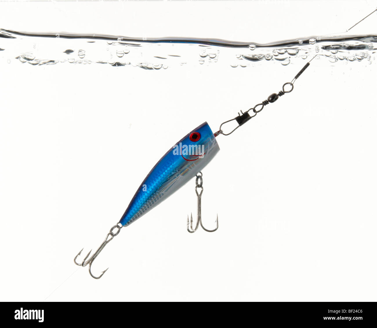 Blue surface popper fishing pike lure, underwater shot with surface of water showing Stock Photo