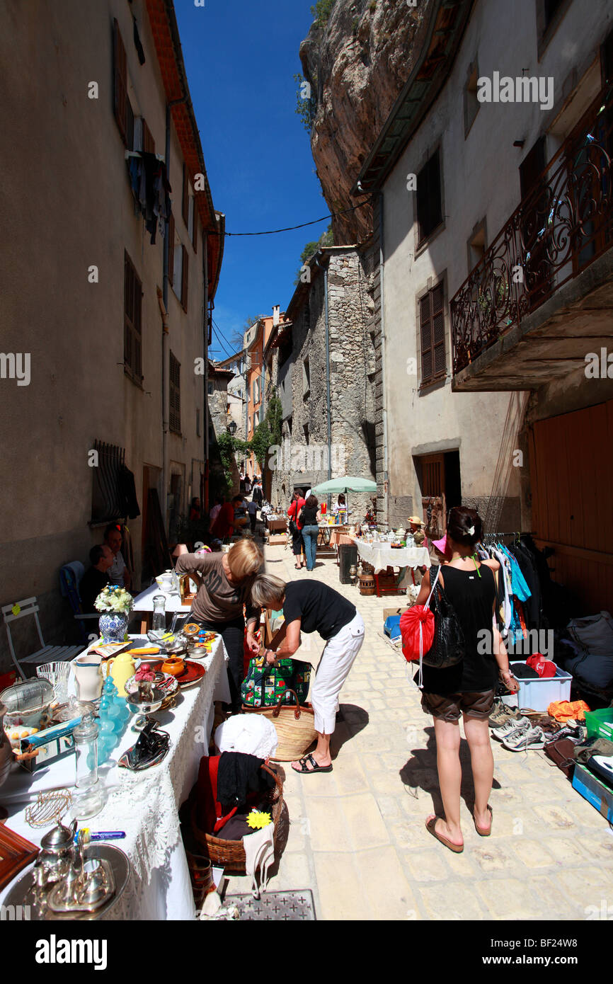 Open air antiquity market into the village street of Sigale in southern France Stock Photo