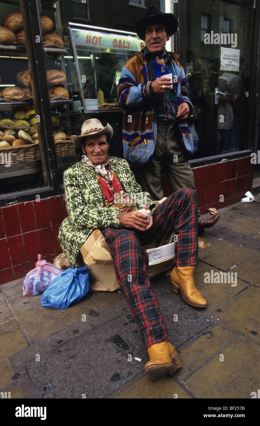 Two Romanies drinking cups of tea in Brick Lane, London England Stock Photo
