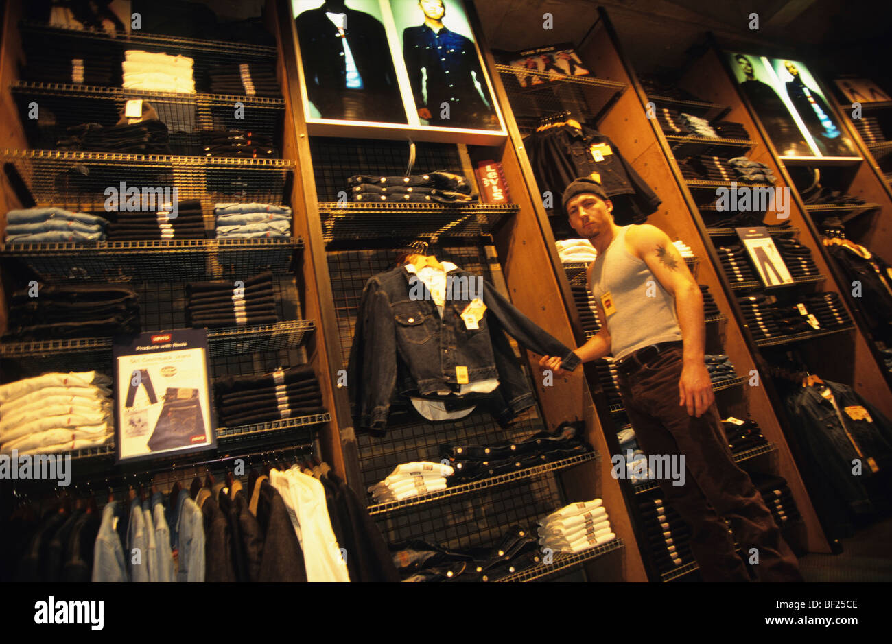 Male shop assistant in Levis made to measure store, London, England Stock  Photo - Alamy