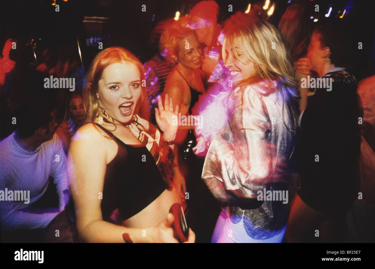 Girls dancing at Scandal nightclub, seventies night, in London Stock Photo
