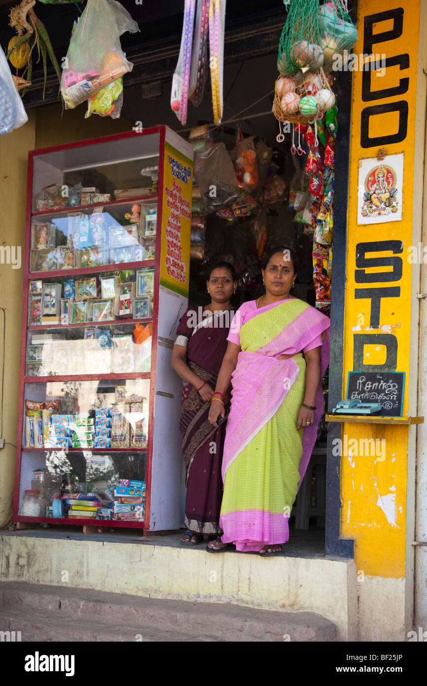 Indian woman standing outside a convenience store. Chennai Tamil Nadu India Stock Photo