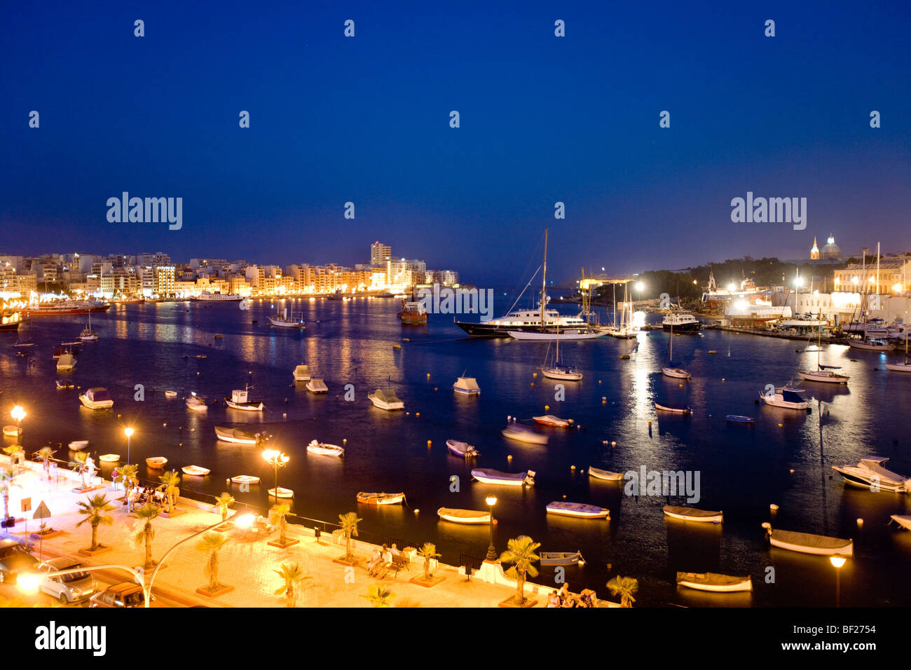 View at the illuminated promenade at Marsamxett Harbour, Sliema Creek, Sliema, Malta, Europe Stock Photo