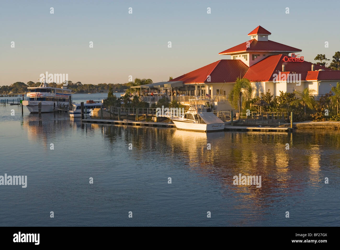 The Catches Waterfront Grille restaurant on the waterfront in the light of the evening sun, Tampa Bay, Port Ritchey, Florida, US Stock Photo