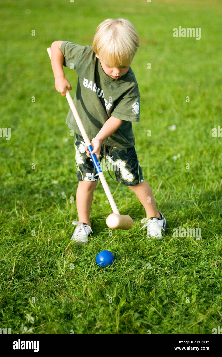 Boy (34) playing croquet, Bavaria, Germany Stock Photo Alamy