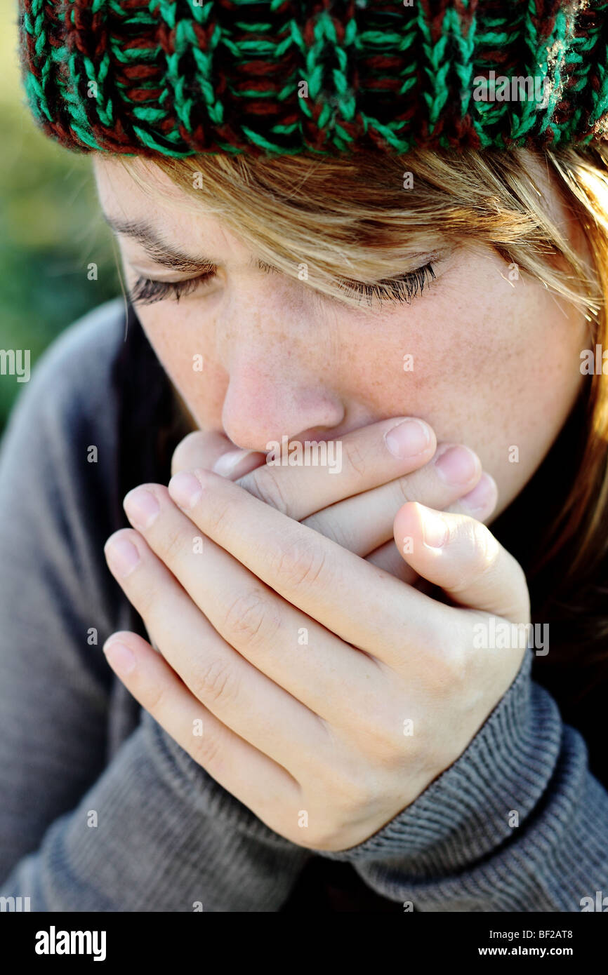 woman is getting cold Stock Photo