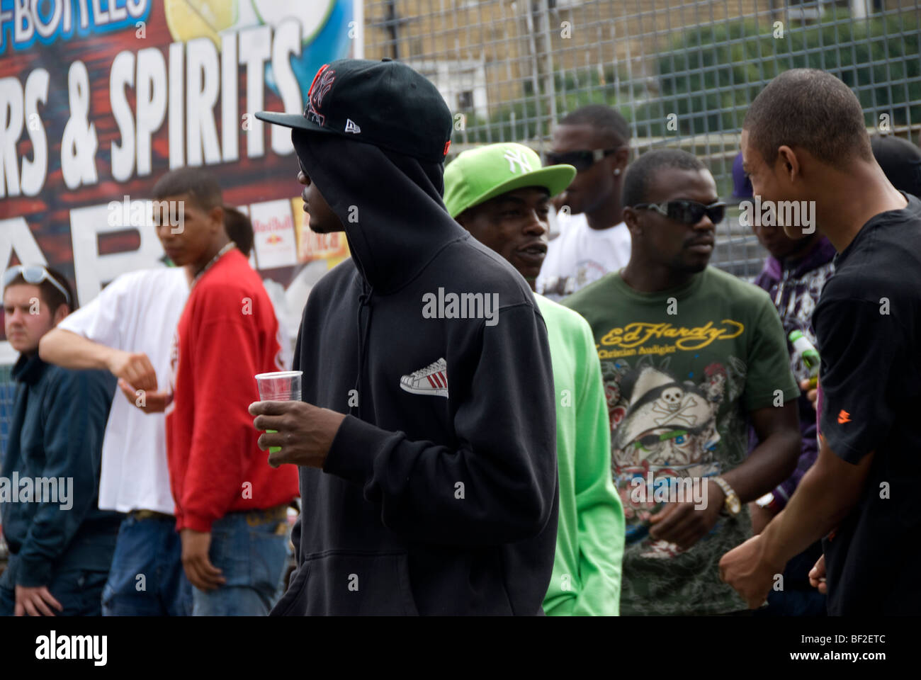 Young men hanging about during Notting Hill Carnival Stock Photo