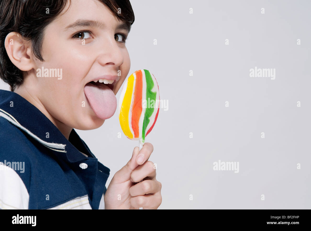 boy lick Portrait of a boy licking a lollipop Stock Photo - Alamy