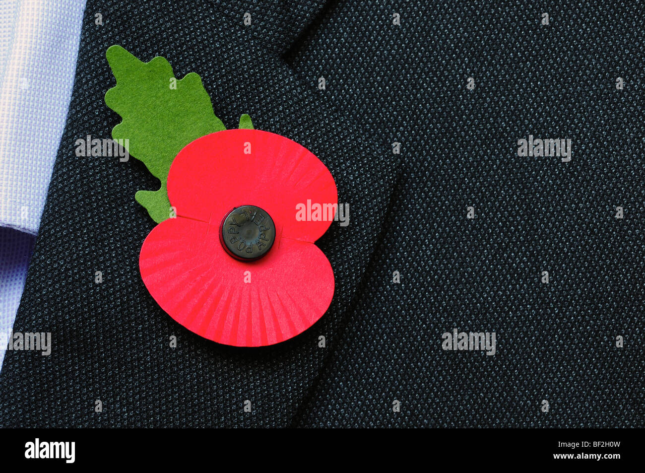 Businessman wearing a red poppy Stock Photo