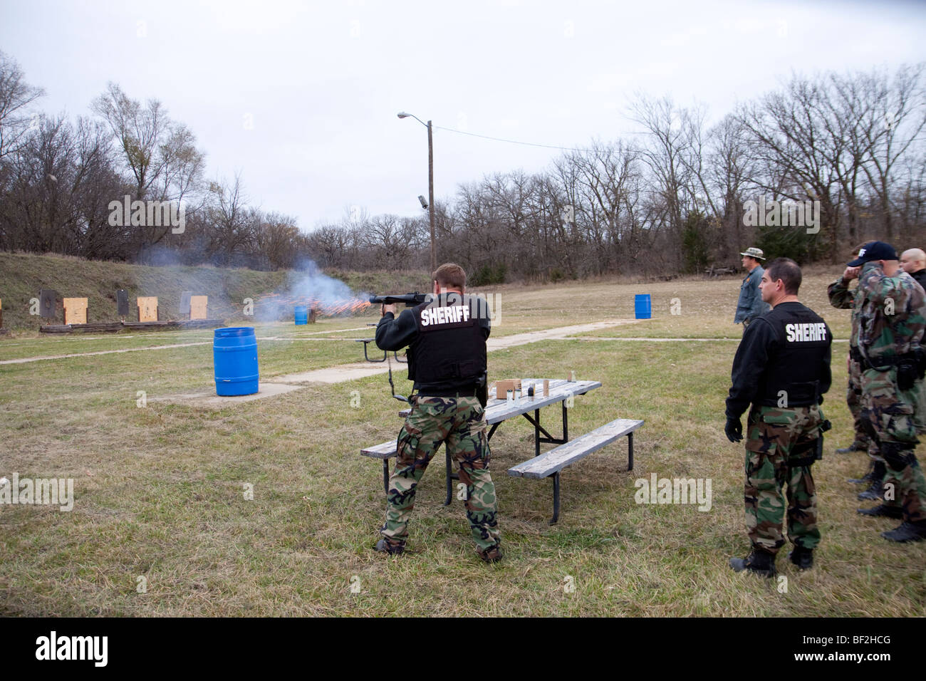 Deputy sheriffs using gas munitions on shooting range. Stock Photo