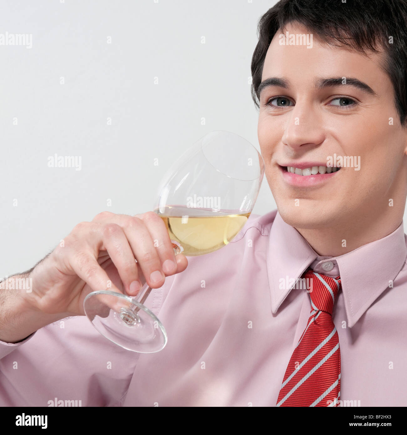 Businessman drinking wine Stock Photo Alamy