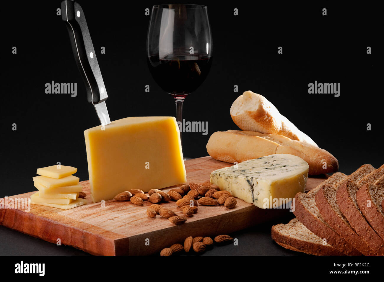 Assorted cheese served with red wine and bread Stock Photo Alamy