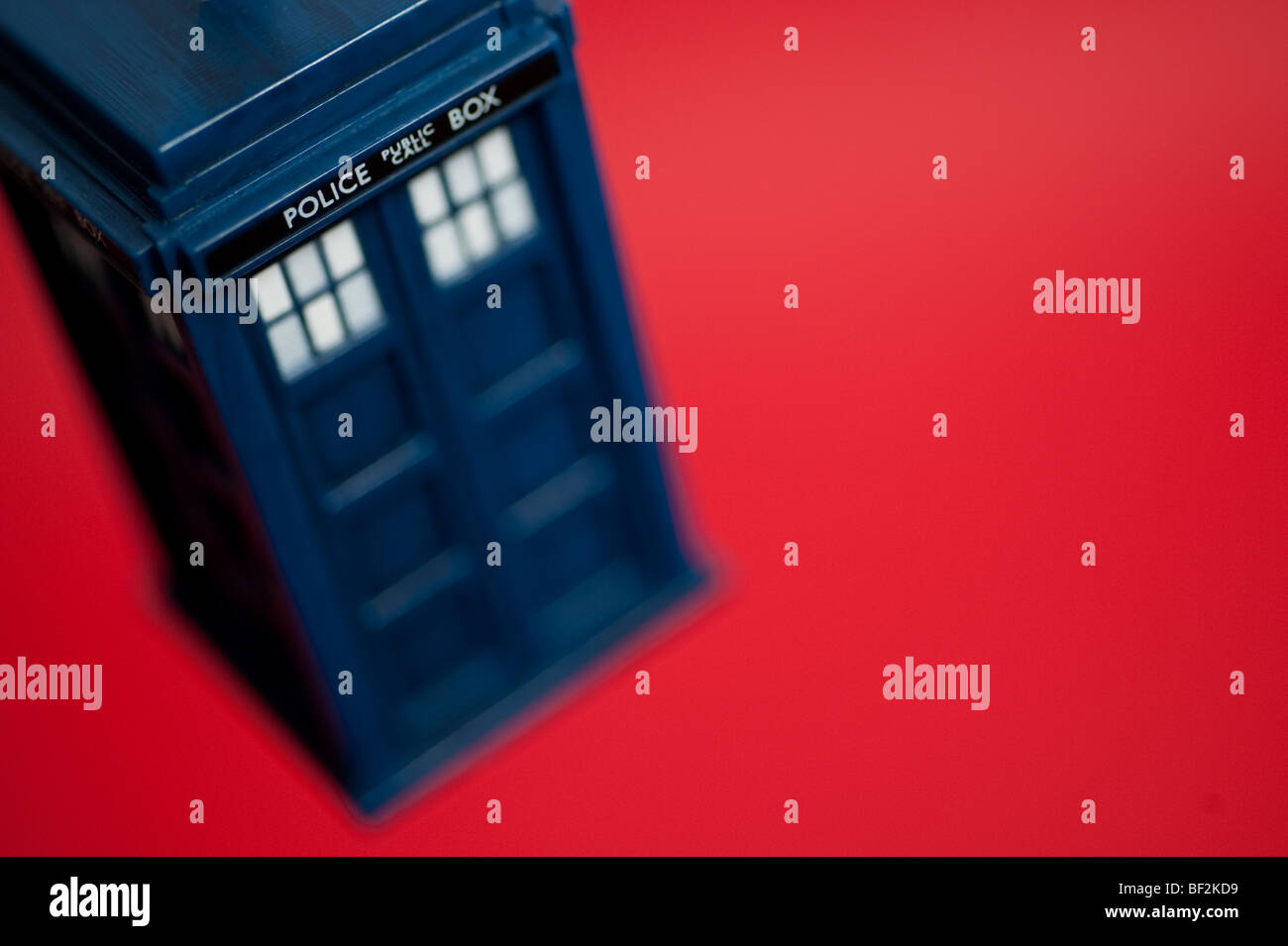 A Doctor Who Tardis keyring hangs in front of a background. Stock Photo