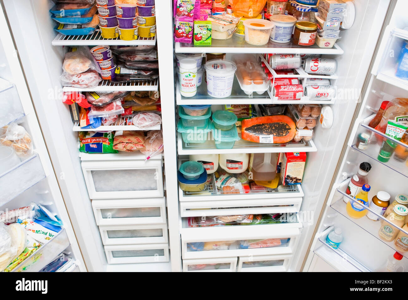 Refrigerator filled assorted food items hires stock photography and