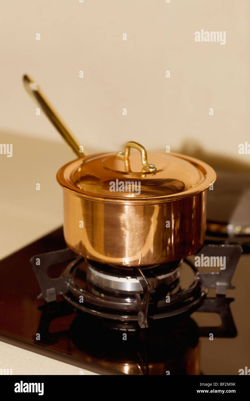 Saucepan on a stove Stock Photo Alamy
