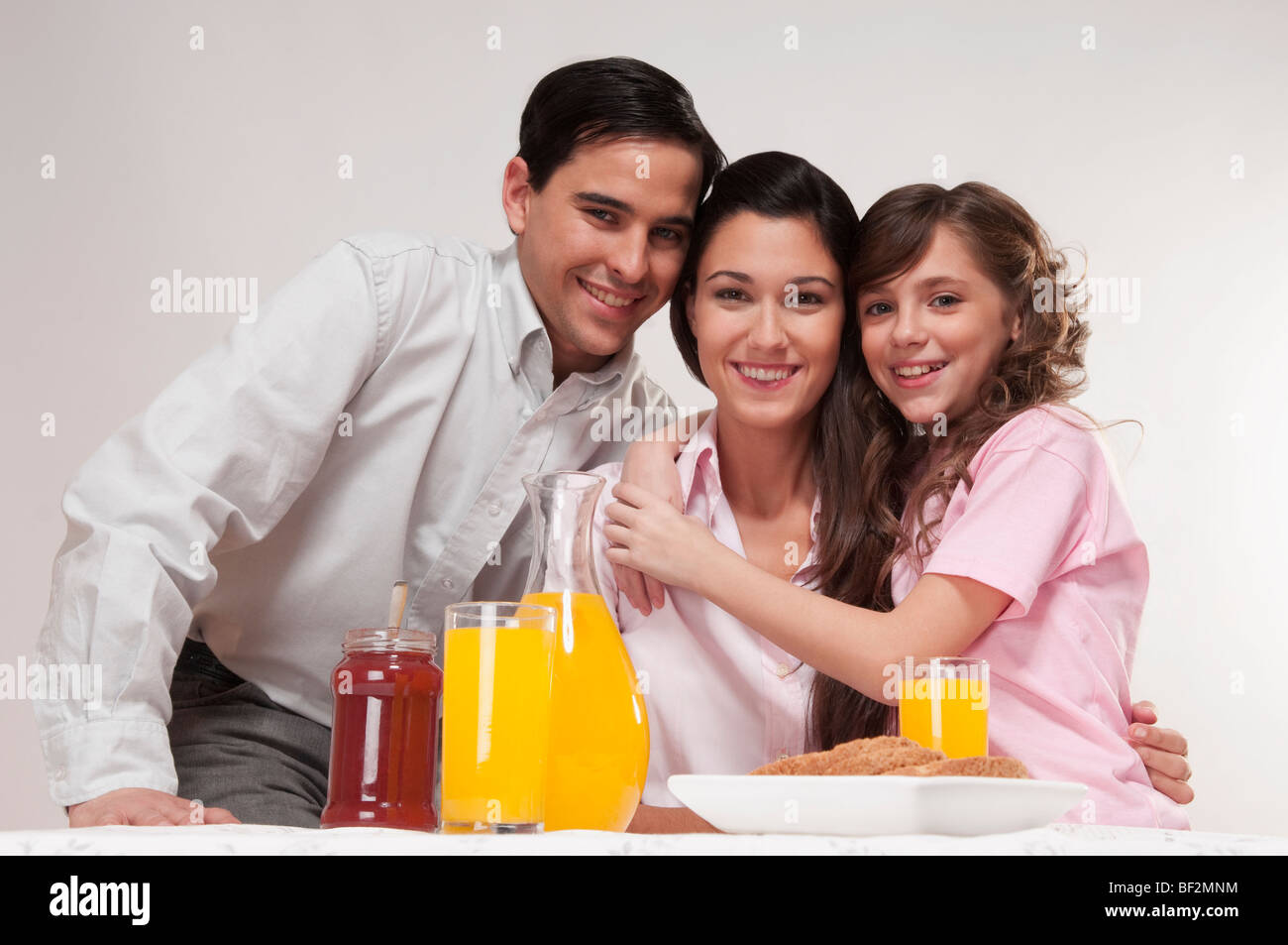 Portrait of a happy family at the breakfast table Stock Photo - Alamy
