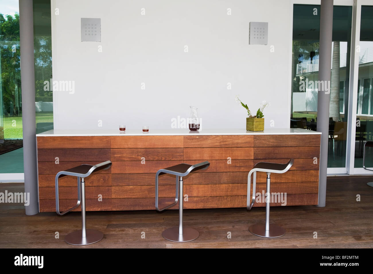 Stools in a row at a bar counter Stock Photo