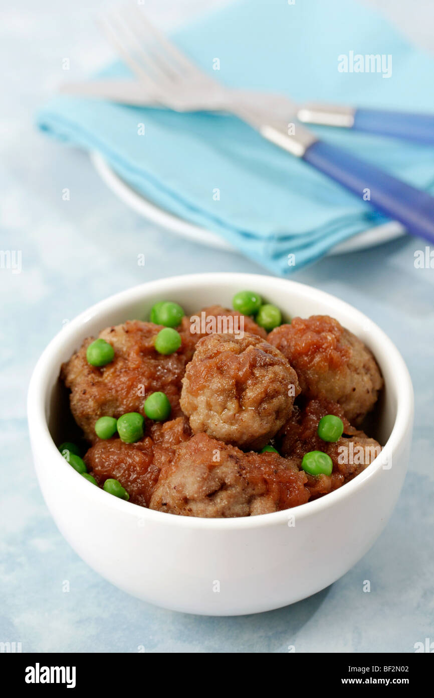 Meatballs with peas. Recipe available. Stock Photo