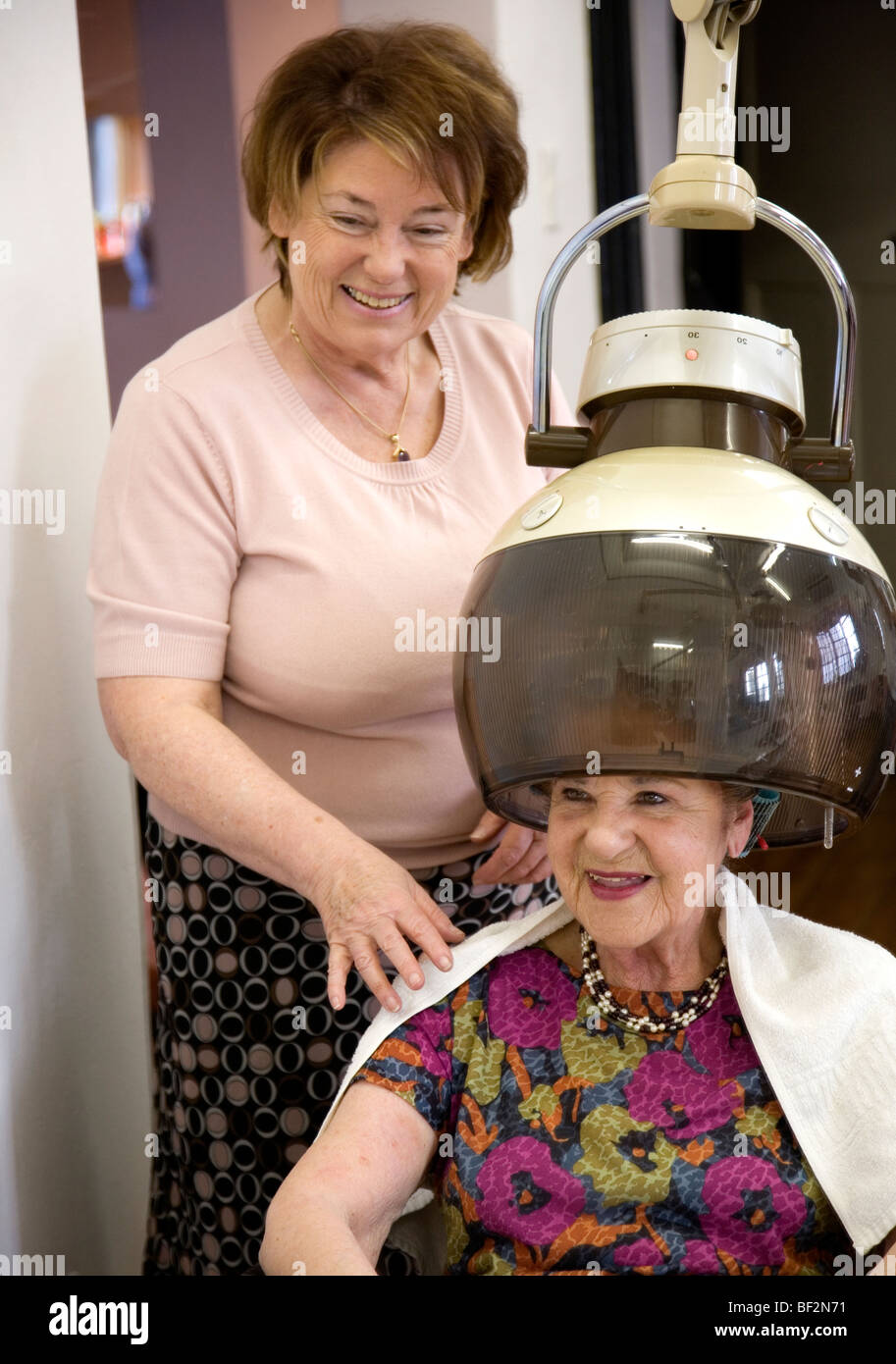 Stylist and Client at The Old Hair Salon Stock Photo