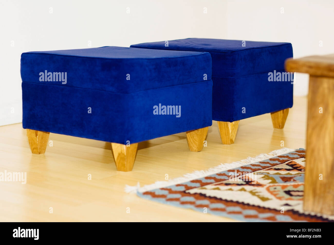 Two blue ottomans in a living room Stock Photo Alamy