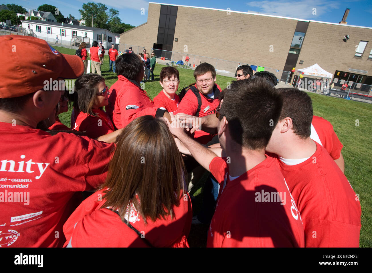 City Year participants start the day with a team building cheer at Beech Elementary School, Manchester, NH. Stock Photo