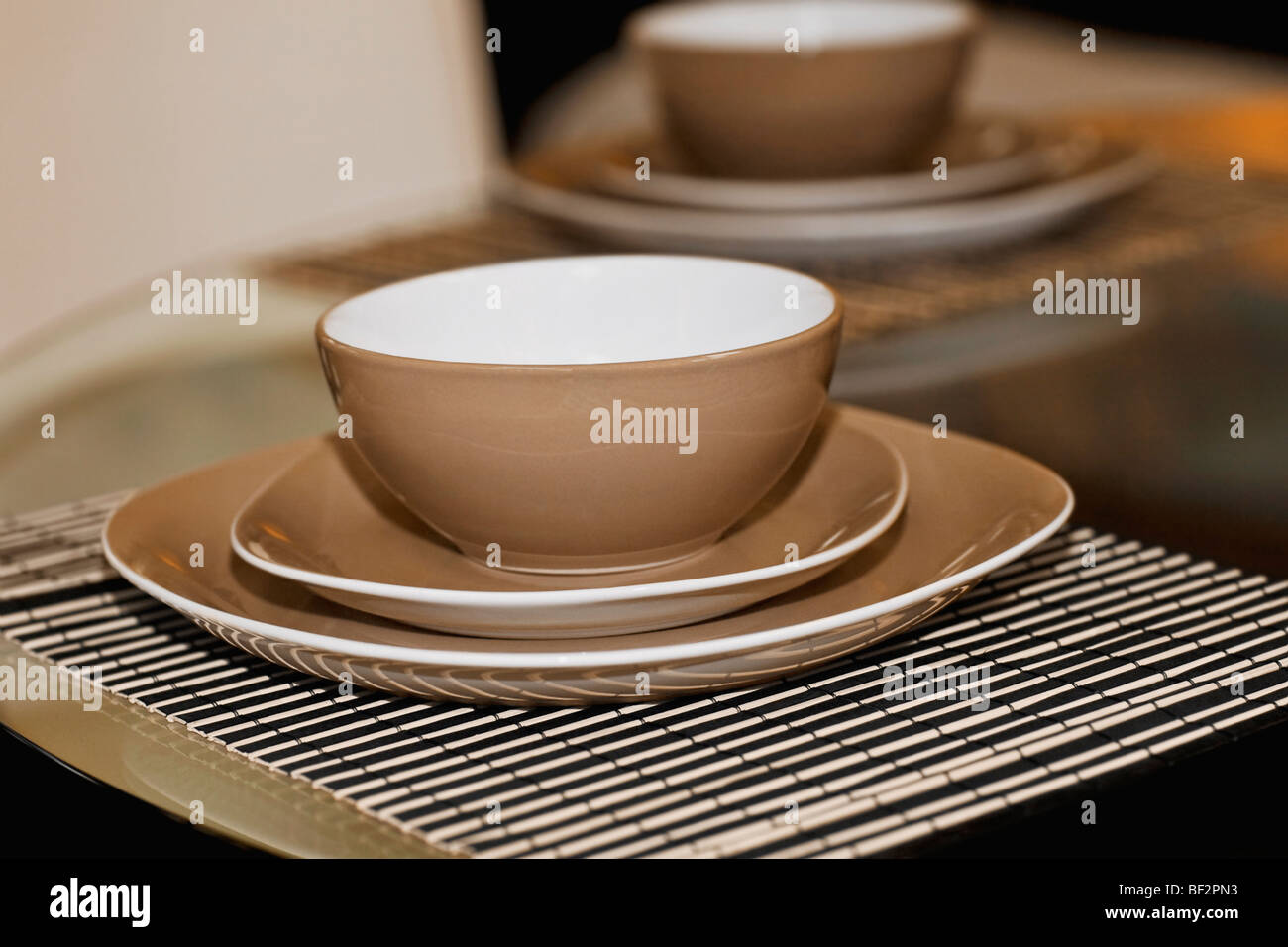 Bowls and plates on a dining table Stock Photo Alamy