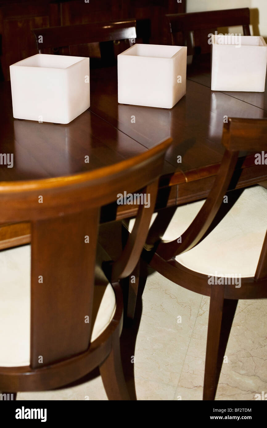 Candlestick holders on a dining table Stock Photo Alamy