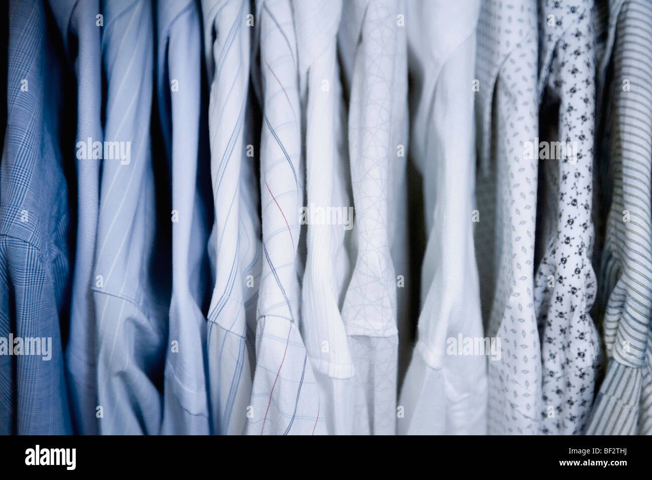 Clothes hanging in a row Stock Photo