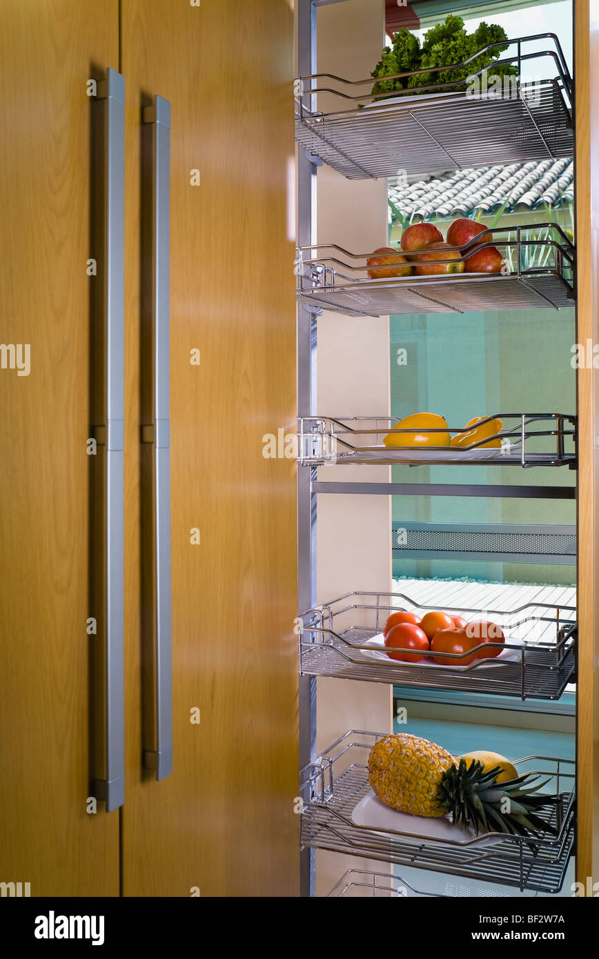 Vegetables on shelves in the kitchen Stock Photo Alamy