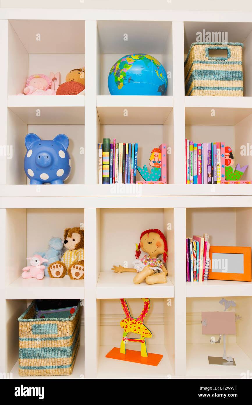 Books and toys on a shelf Stock Photo Alamy