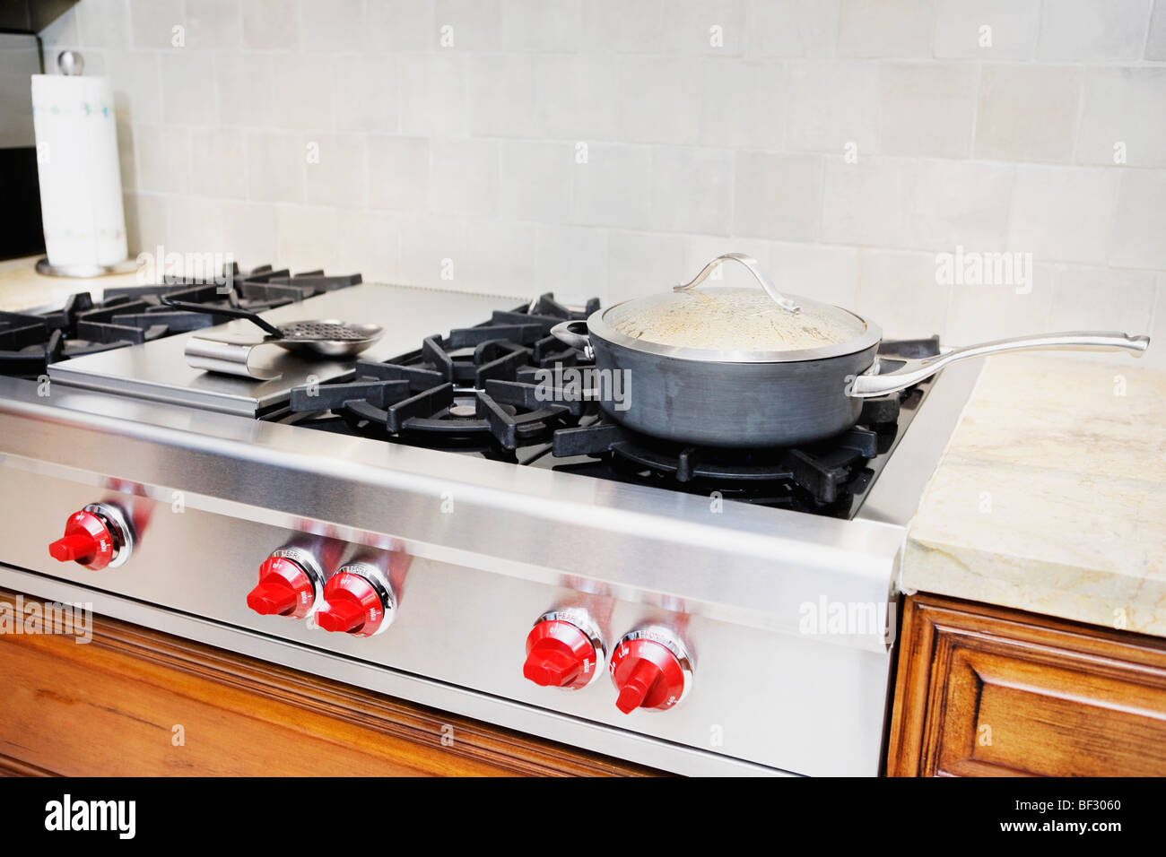 Frying pan on a gas stove Stock Photo Alamy