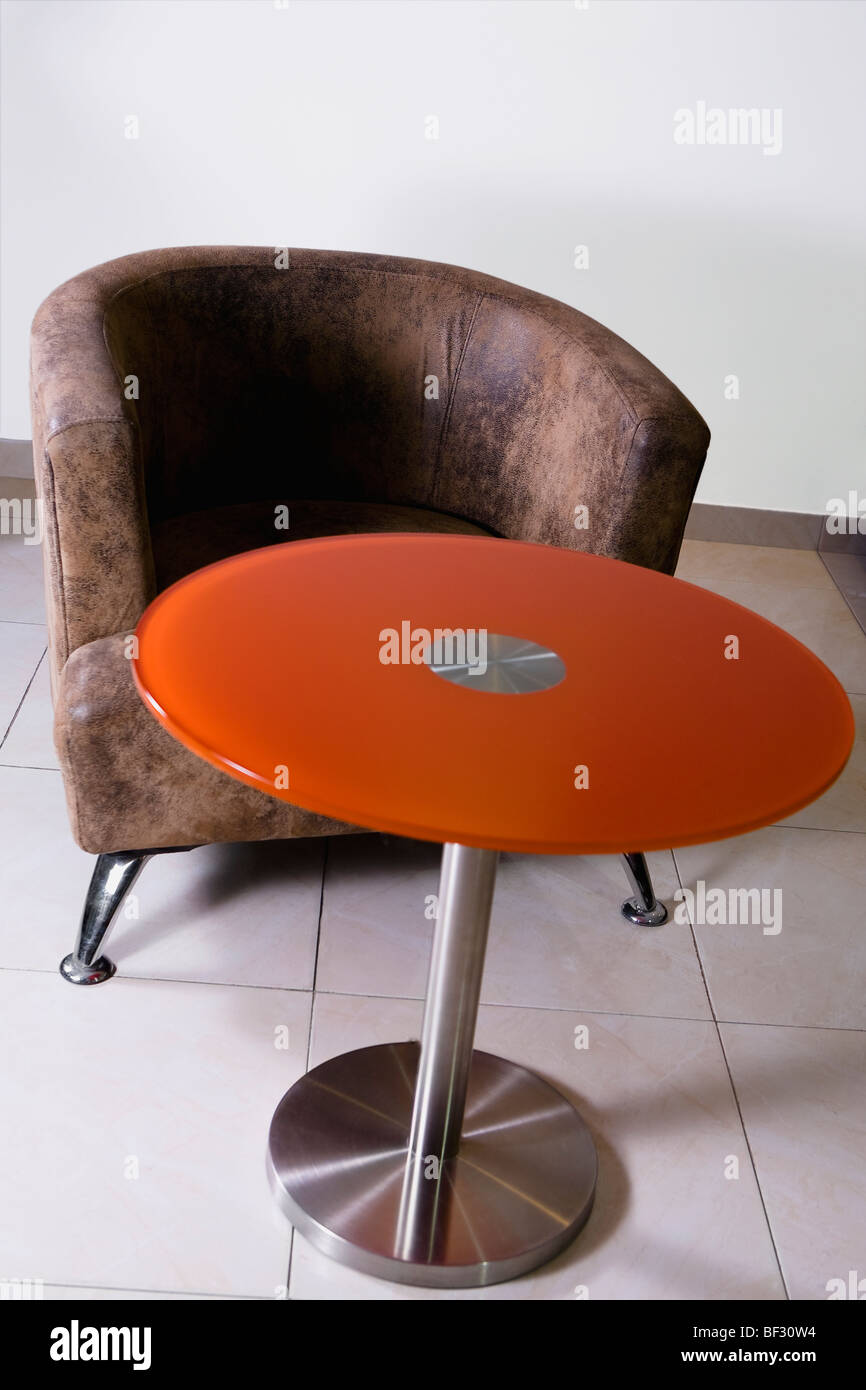 Armchair and table in a living room Stock Photo Alamy
