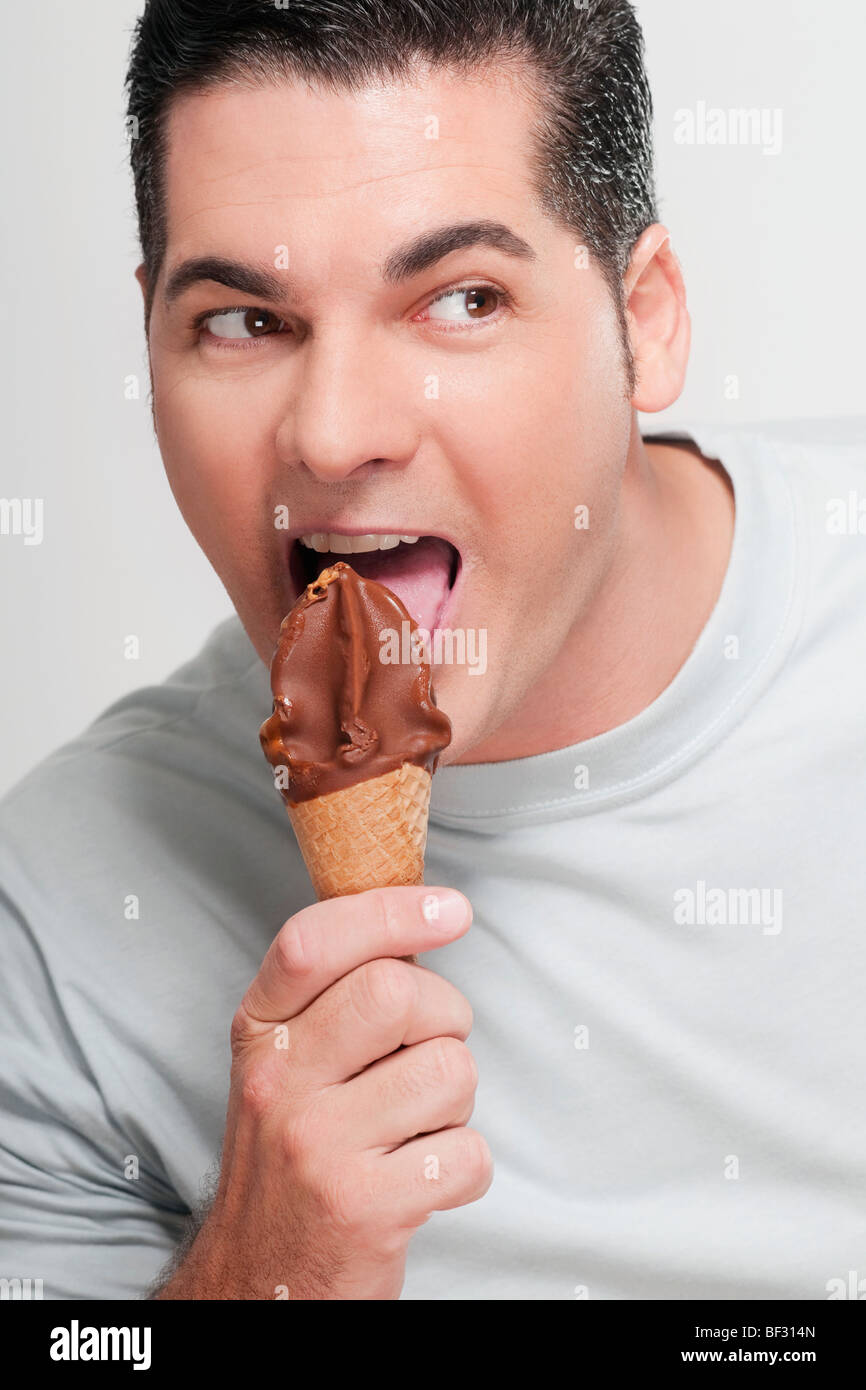 Closeup of a man eating an ice cream cone Stock Photo Alamy