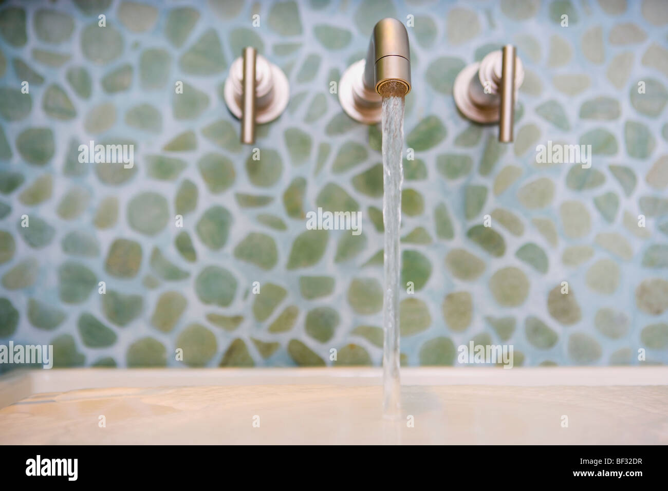 Water running from a faucet Stock Photo Alamy