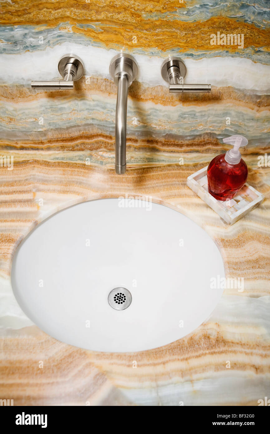 Faucet near a bathroom sink Stock Photo Alamy