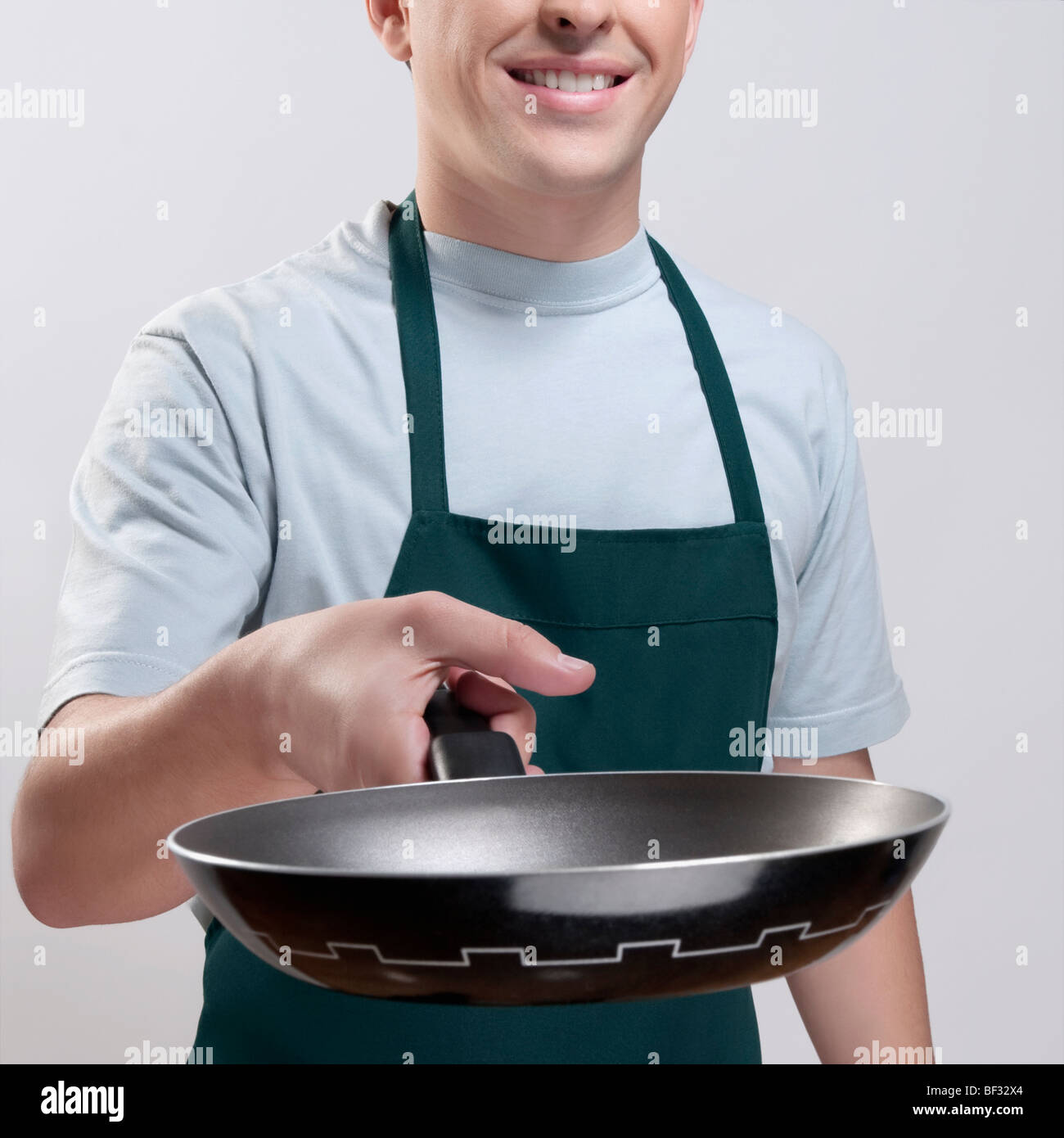 Man holding a frying pan Stock Photo Alamy