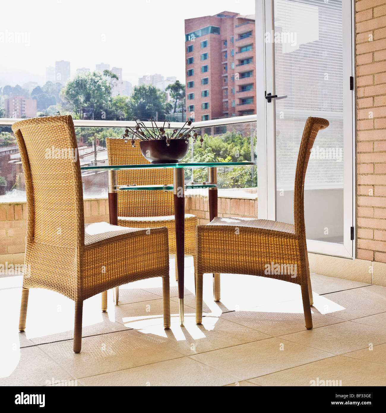 Wicker chairs with a table in the balcony Stock Photo - Alamy