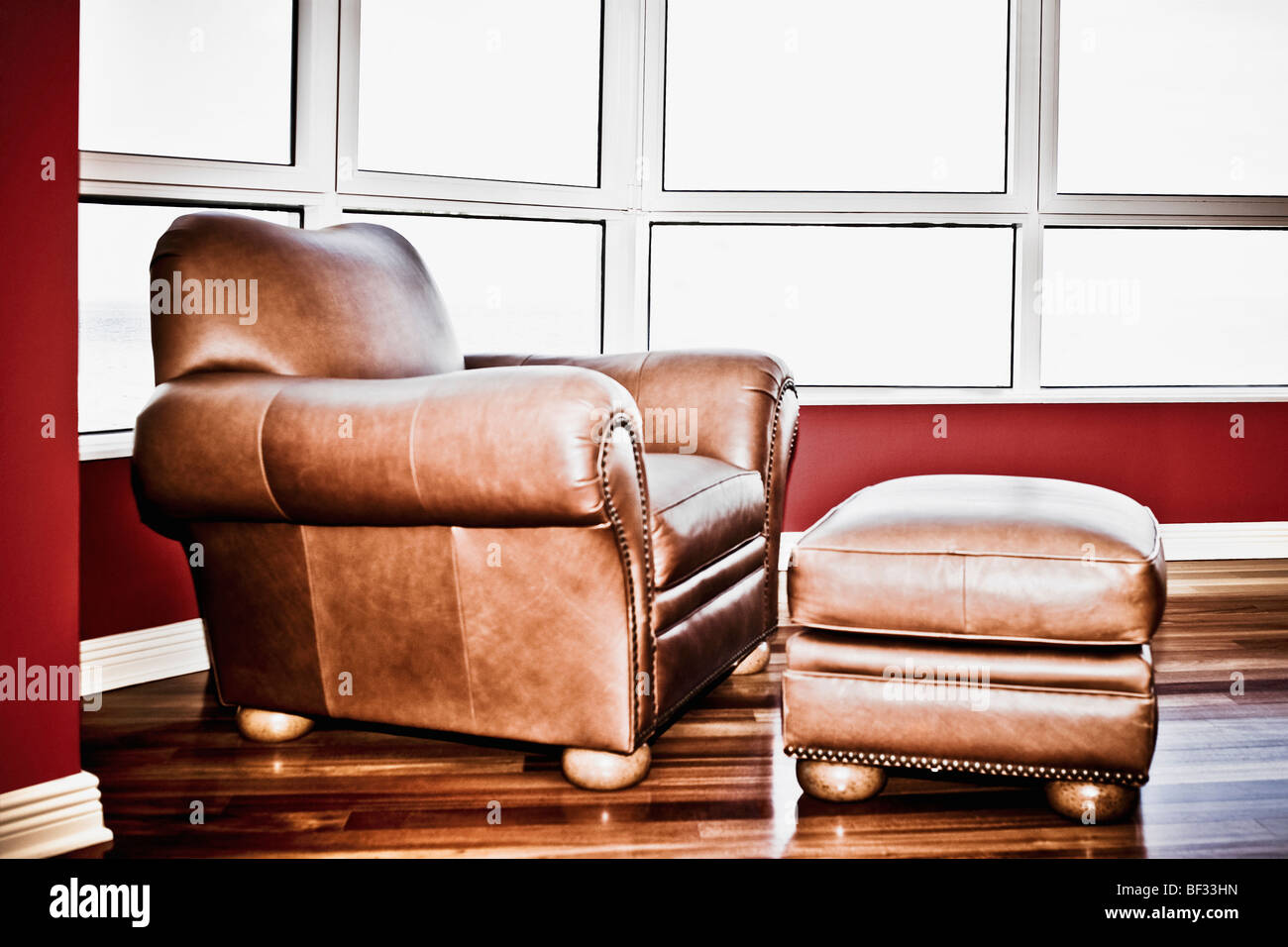 Armchair with a footstool Stock Photo Alamy