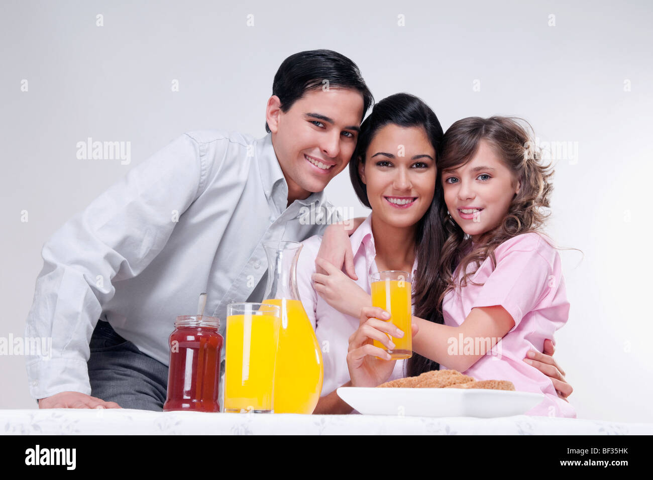 Portrait of a happy family at a breakfast table Stock Photo - Alamy