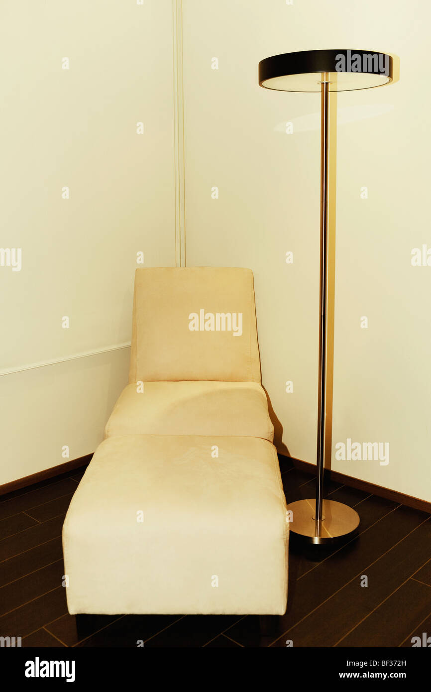 Futon and a floor lamp in the corner of a room Stock Photo Alamy