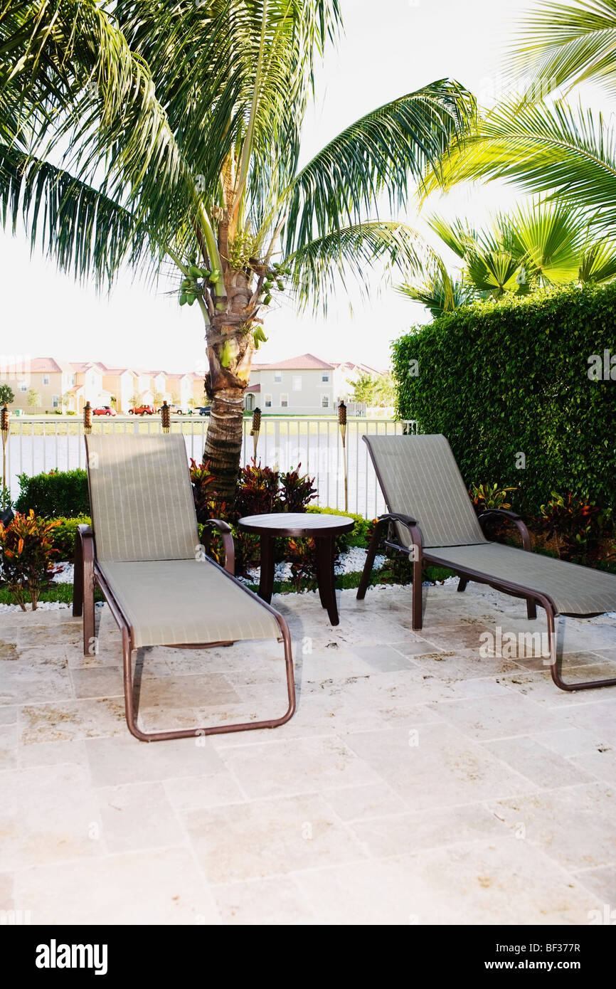 Lounge chairs in a garden Stock Photo