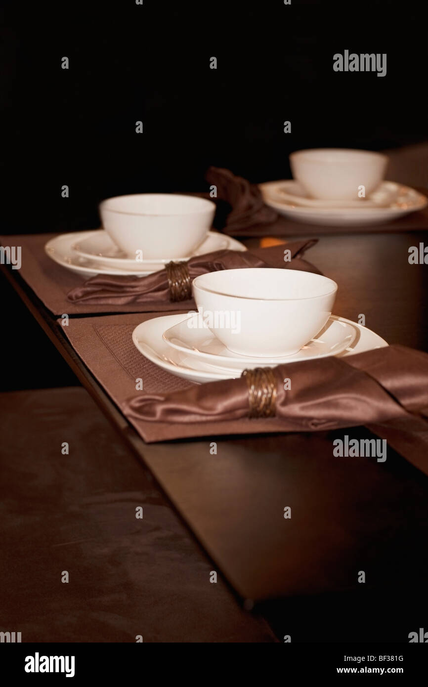 Bowls and plates on a dining table Stock Photo Alamy
