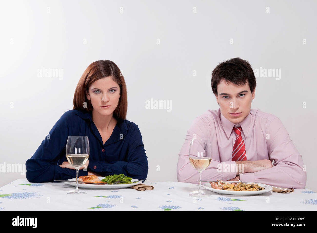 Portrait of a couple sulking at the dinner table Stock Photo