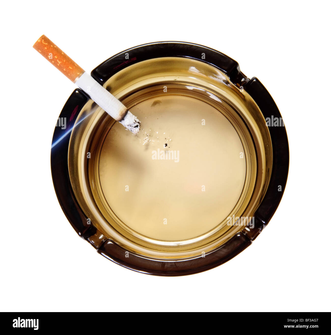 Burning cigarette in ash tray. Top view. Isolated Stock Photo