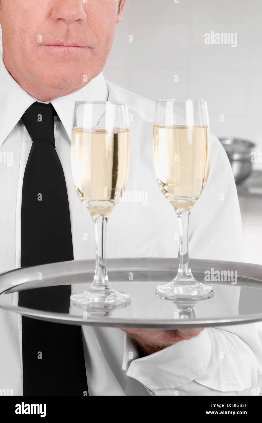 Waiter carrying food tray hi-res stock photography and images - Alamy