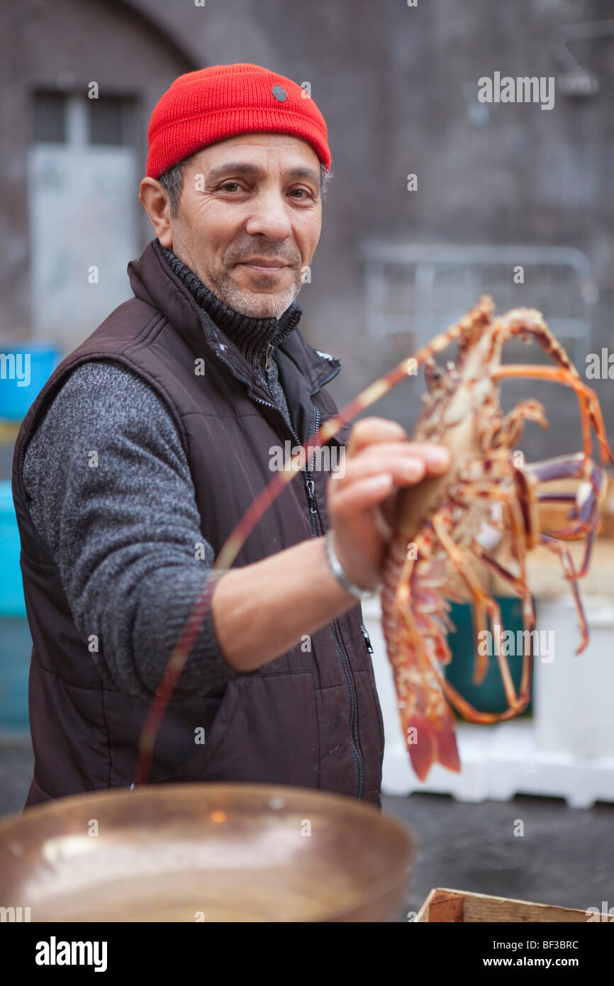 fisherman presenting lobster Stock Photo Alamy