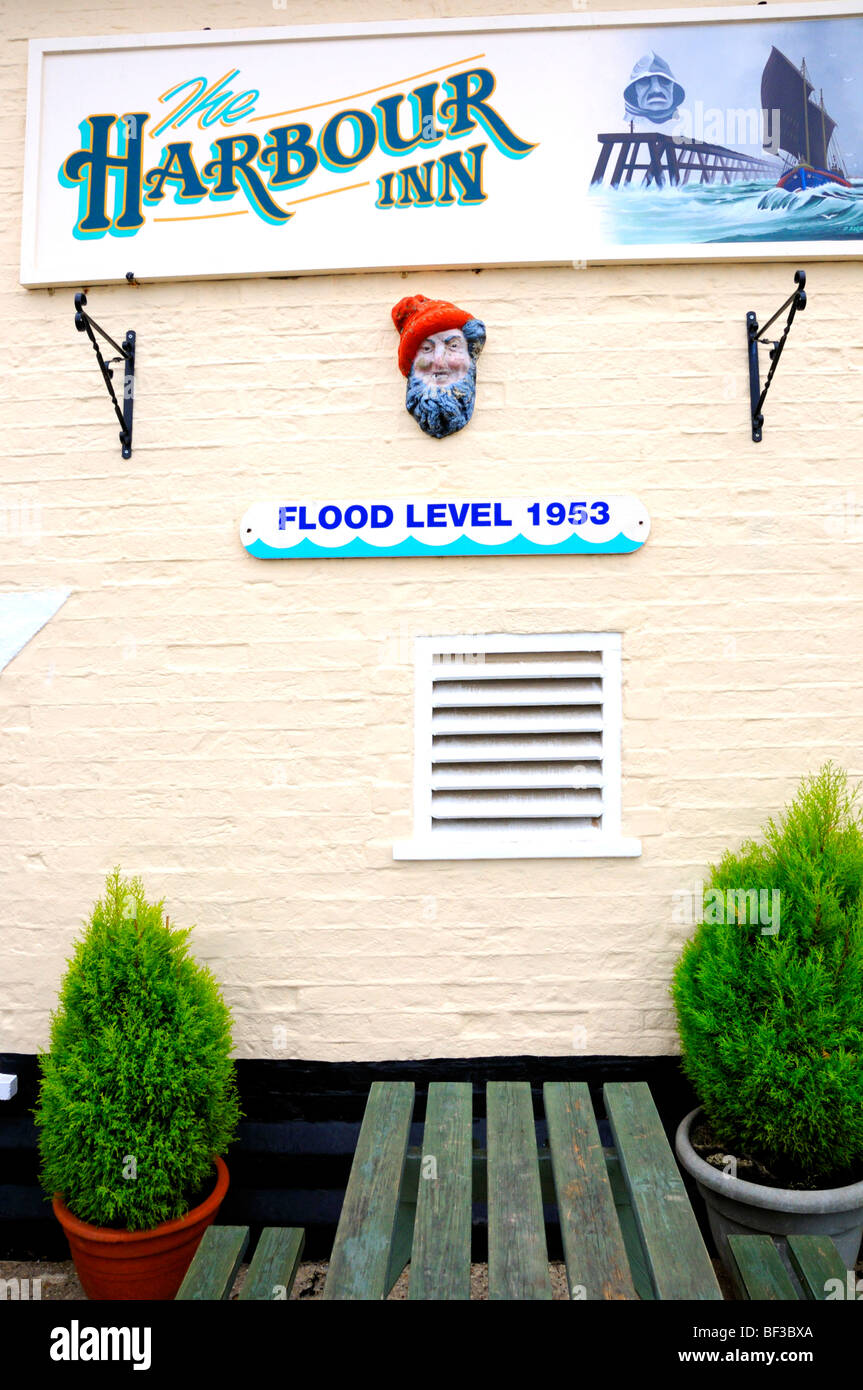 Southwold, Suffolk, England, UK. The Harbour Inn. Sign on outside wall showing flood level from 1953 Stock Photo