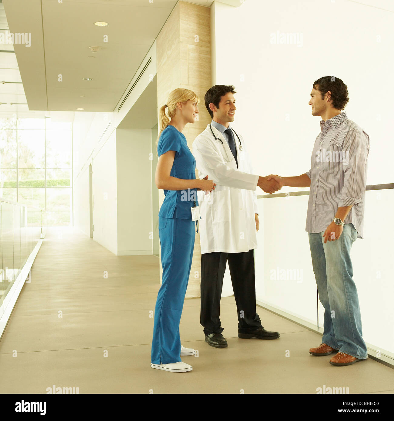 Doctor with patient in hospital Stock Photo