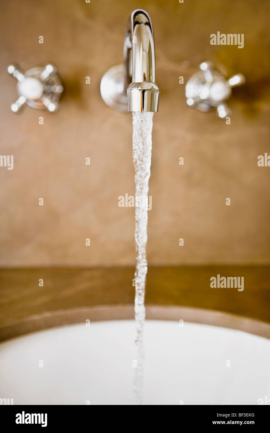 Water running from a faucet Stock Photo Alamy