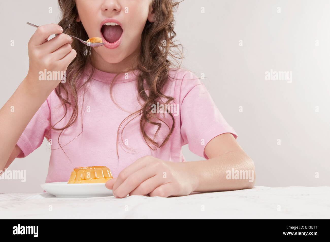 Girl eating jelly Stock Photo Alamy